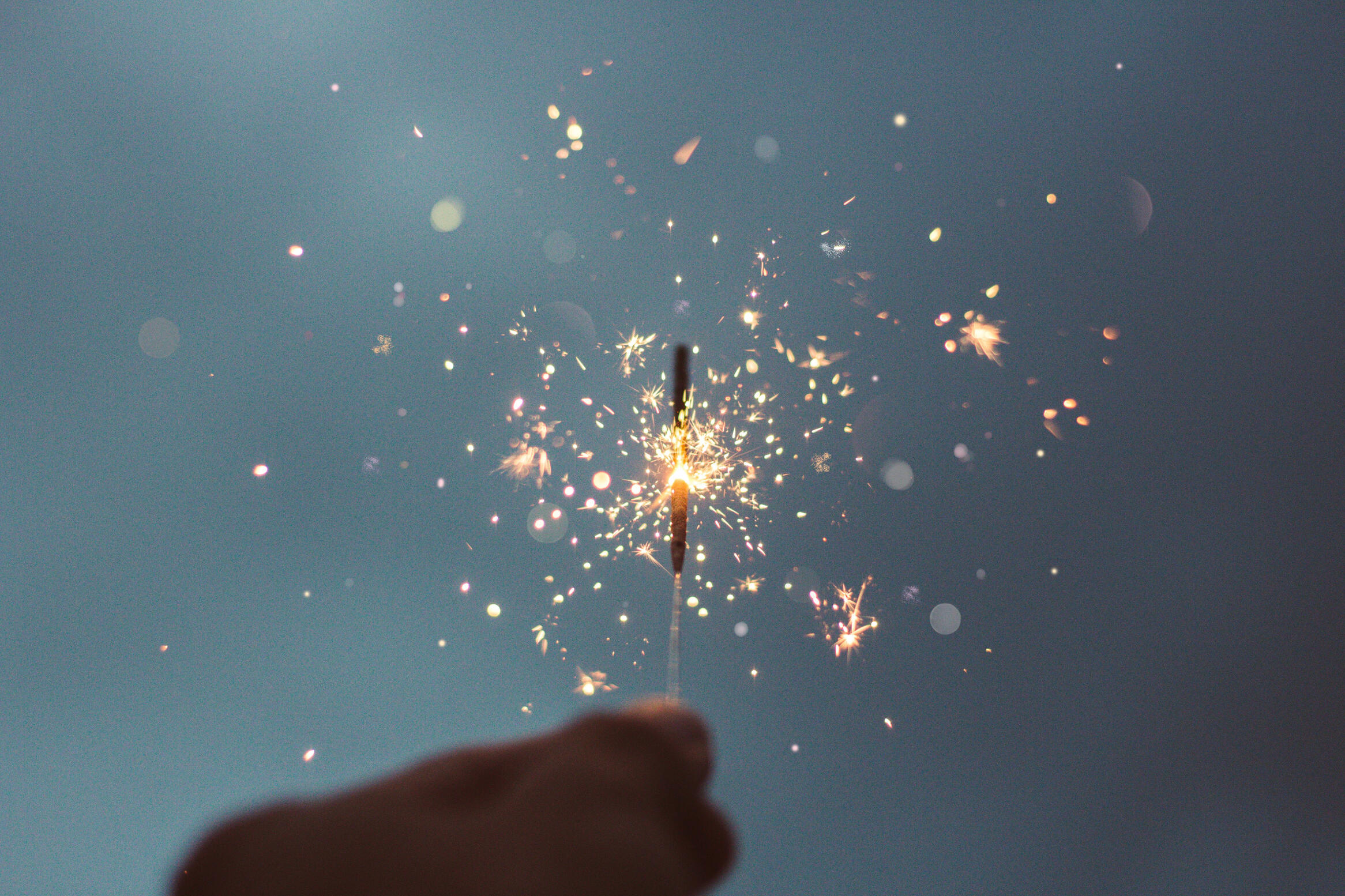 Celebrating life's special moments from a great experience Sparkler being held during a celebration, symbolizing special events