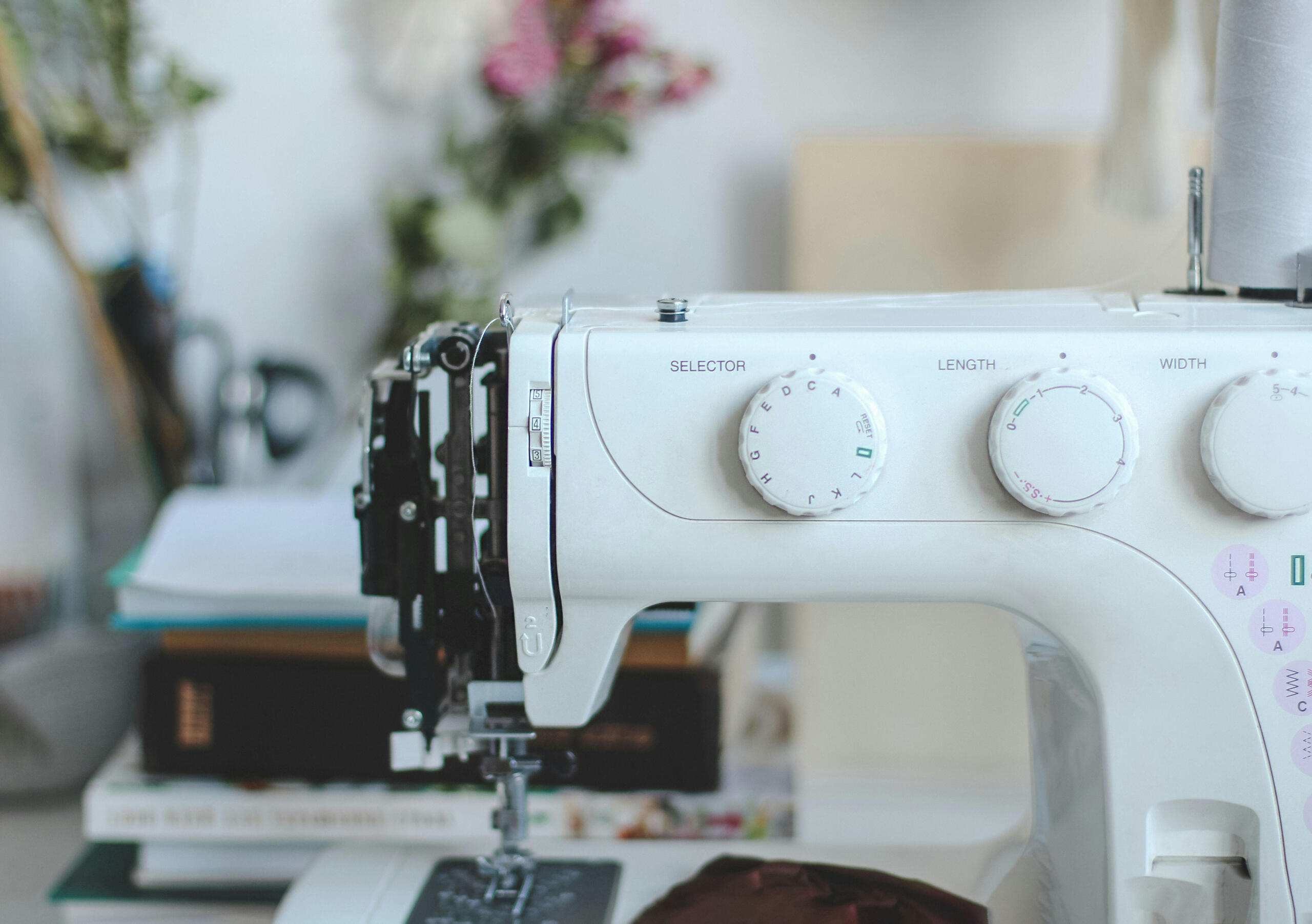 Professional tailoring equipment used for alterations Close-up view of sewing machine used in garment alterations